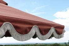 Terracotta Scalloped Parasols with Cream Fringe Terracotta Scalloped Parasols with Cream Fringe