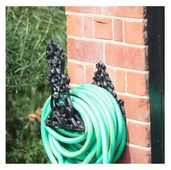 Decorative store hose holder