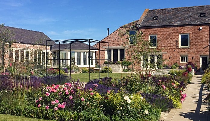 Daisy Barn Garden Square Pergola with climbing roses and clematis