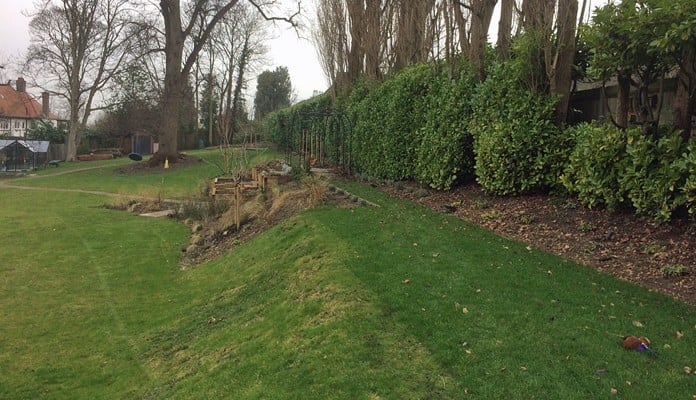 Roman Bisecting Pergola Above Ground Winter 4